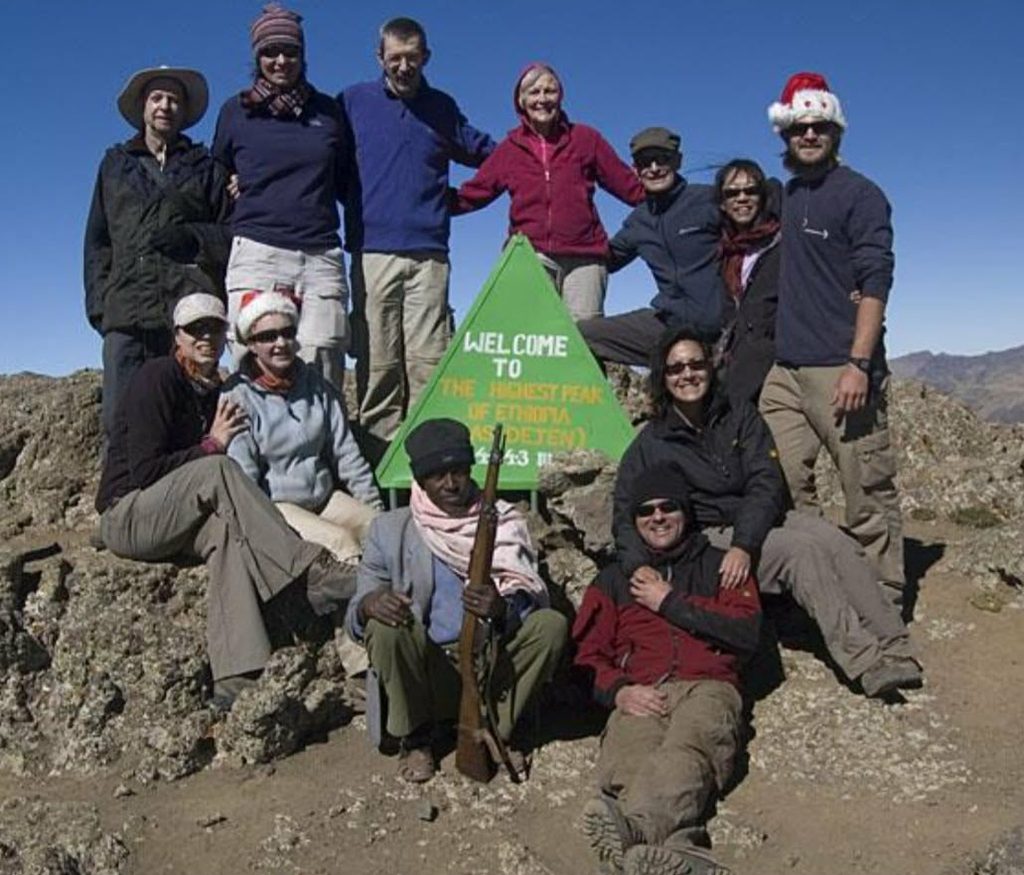 Tour group reaching Ras Dashen Summit Simien Mountains Ethiopia